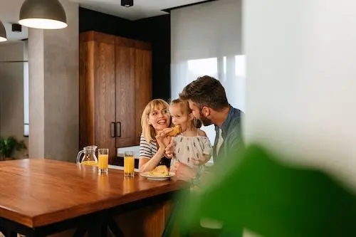 parents-and-child-eating-breakfast-at-table.jpg