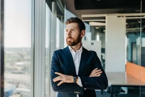 real-estate-agent-looking-out-window.jpg