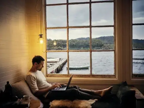 man researching on laptop