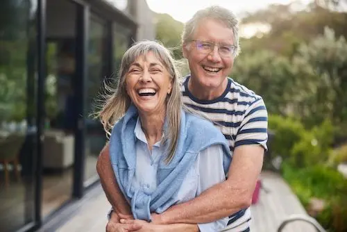 mature-couple-outside-home.jpg